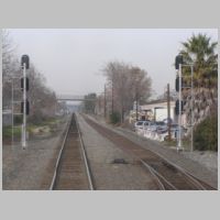Caltrain_CP-DE-LA-CRUZ-sb-masts-rear-cloudy.jpg
