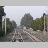 Caltrain_CP-MARY-sb-masts-rear-cloudy.jpg