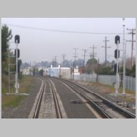 Caltrain_CP-RALSTON-sb-masts-rear-cloudy.jpg