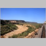 BNSF_Gallup-Sub-174.3-dry-riverbed+rock-cliffs-far-wb.jpg